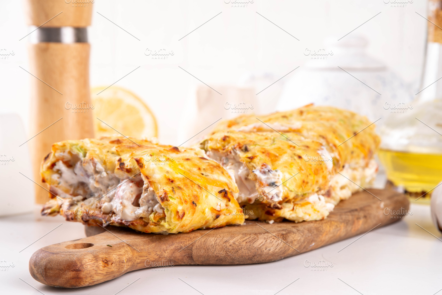 Zucchini roll stuffed with cream cheese or yogurt with tomatoes, a Photo by Rimma