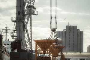 Port crane loading bulk materials, an Industrial Photo by SkyNext