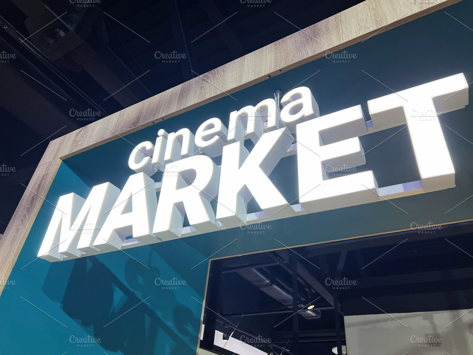 Illuminated entrance sign for a cinema themed market in modern interior design, a Photo by AS photostudio