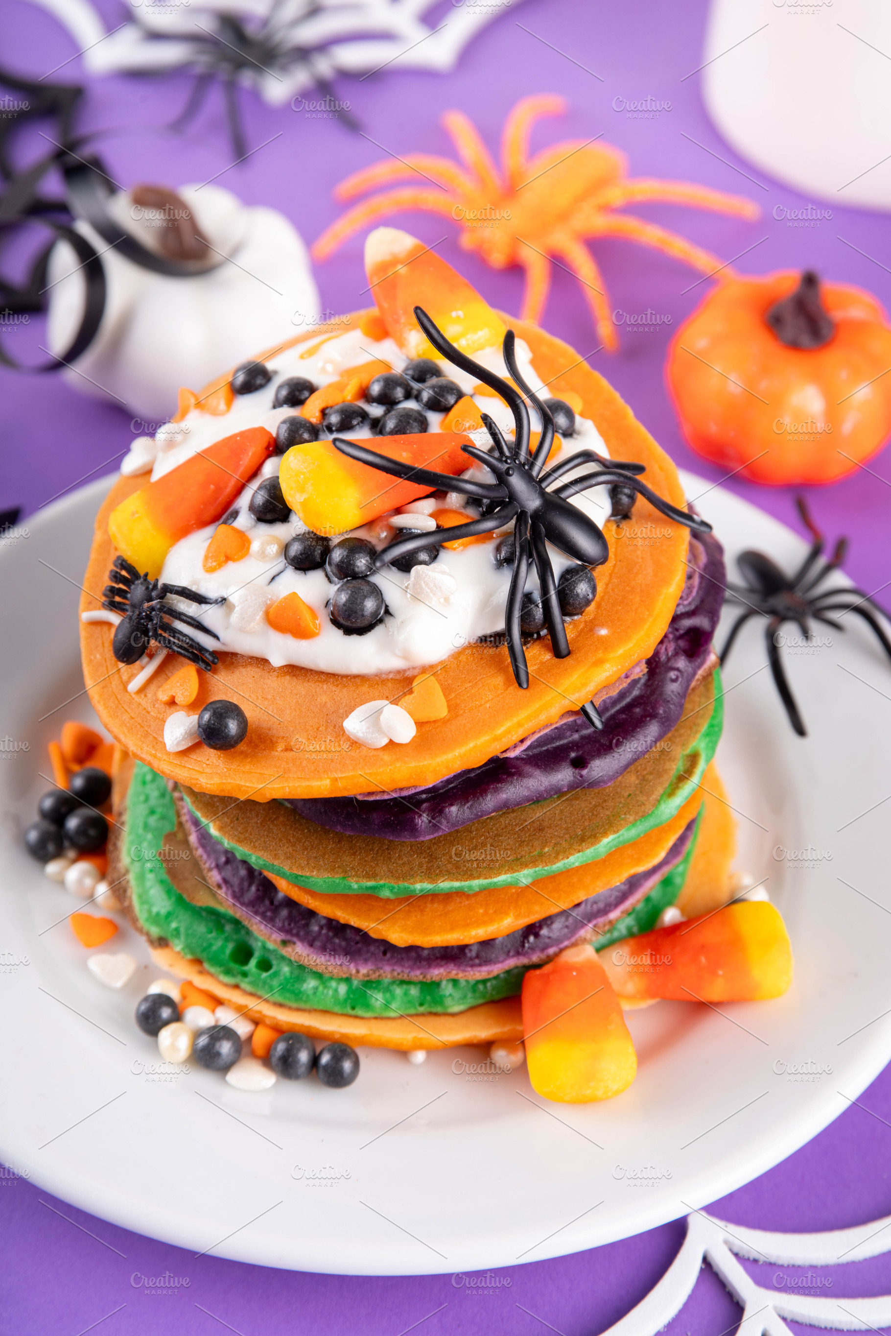 Colorful Halloween Pancakes with candy, pumpkin spider decoratio, a Food & Drink Photo by Rimma