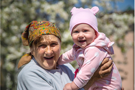 Grandmother holds her granddaughter, a Person Photo by yanadjana