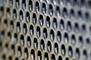 Macro texture of a stainless steel grater with small perforated holes. Abstract, a Background Photo by Rohan Photography