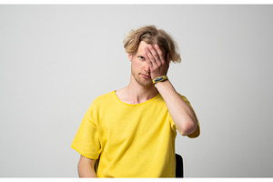 Young man wearing a yellow t-shirt, a Person Photo by volodymyrshtun13795