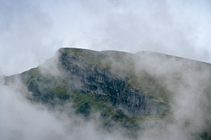 Rocky mountain out of clouds