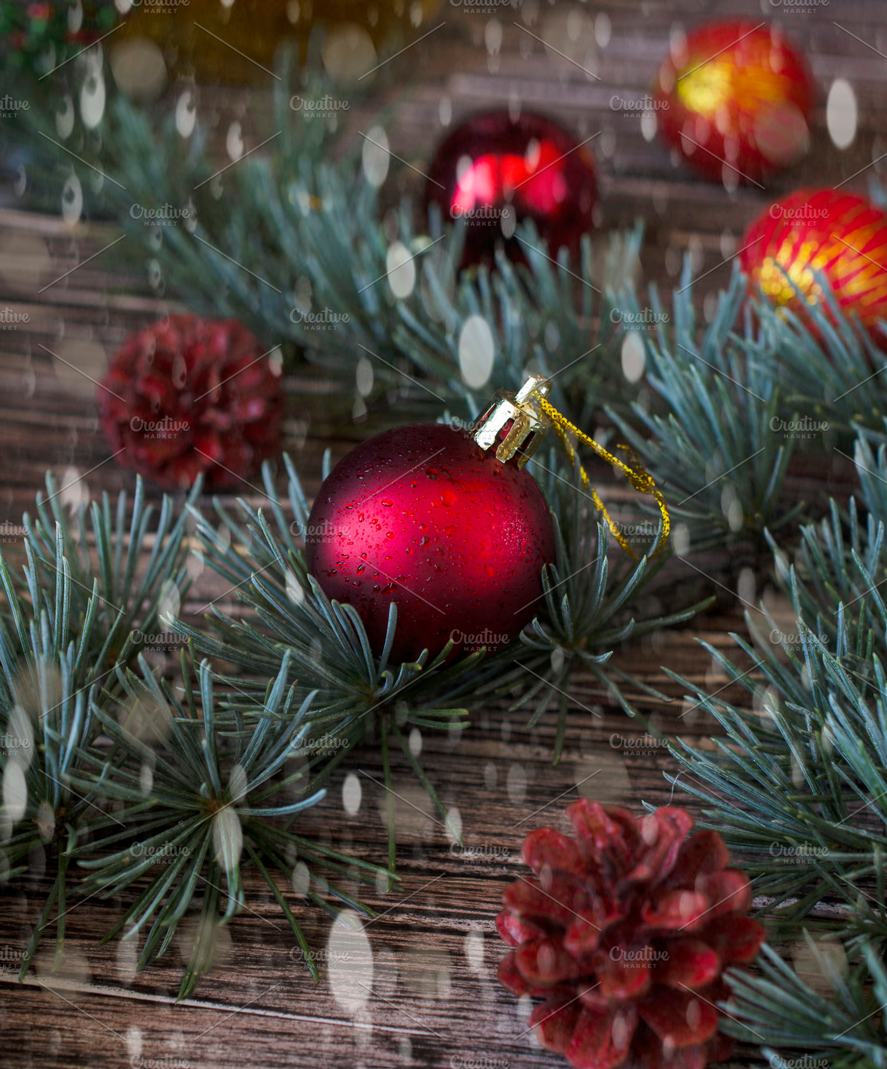 Christmas balls with fir branches lying on a wooden table featuring, a Holiday Photo by Wild Drago Shop