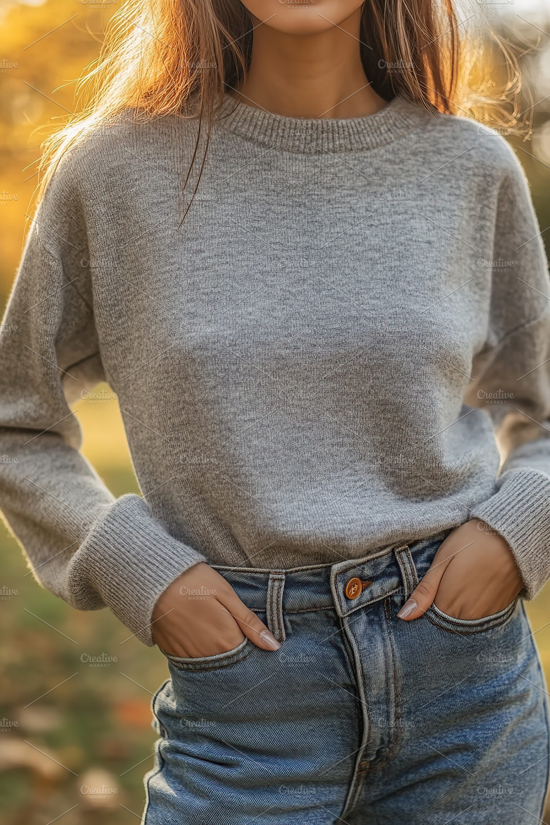 Young woman wearing in grey sweater in autumn park, a Person Photo by AlyaAnd