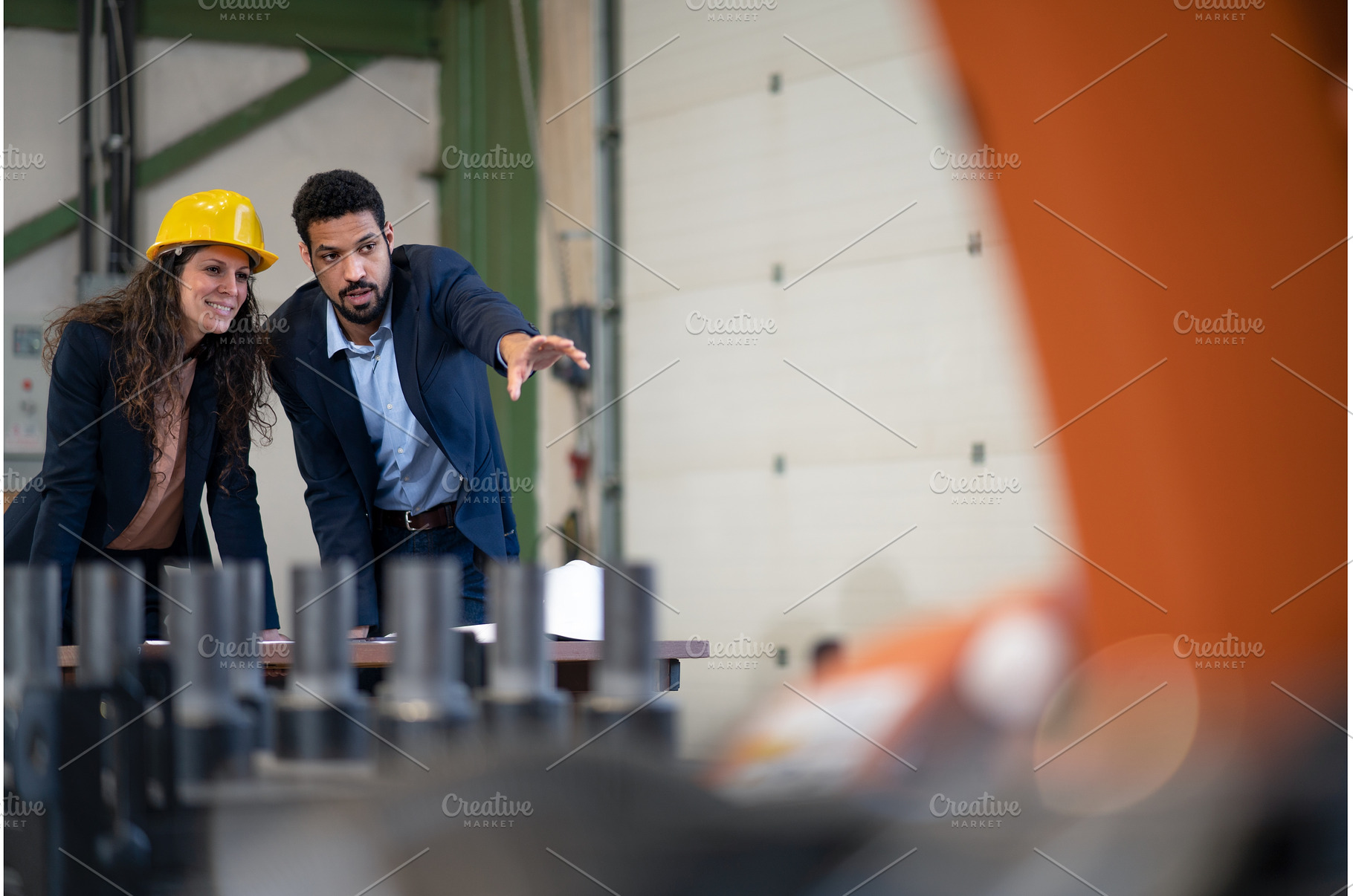 Man engineer showing machines to his, a Person Photo by HalfPoint