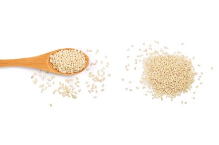 Sesame seeds in a wooden spoon, a Food & Drink Photo by NataPhoto