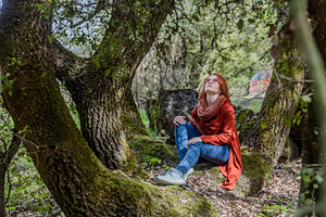 Dreamy redhead woman sitting on a th, a Person Photo by Imaginarium