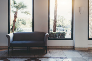 Minimal sofa near bright windows, an Architecture Photo by SkyNext