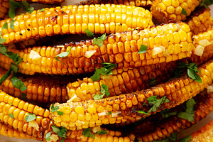 Homemade Spicy Corn Ribs with Mayo on a Plate, top view. Close-u, a Food & Drink Photo by LiudmylaChuhunova