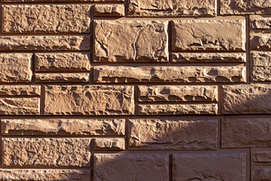 Close-up of a decorative stone brick, an Architecture Photo by Edalin's Store