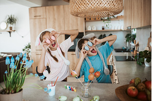 Siblings holding decorated easter, a Holiday Photo by HalfPoint