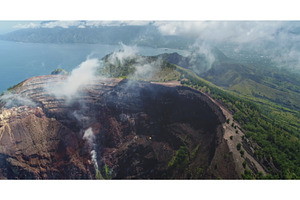 Volcano crater emitting smoke and, a Nature Photo by Goinyk