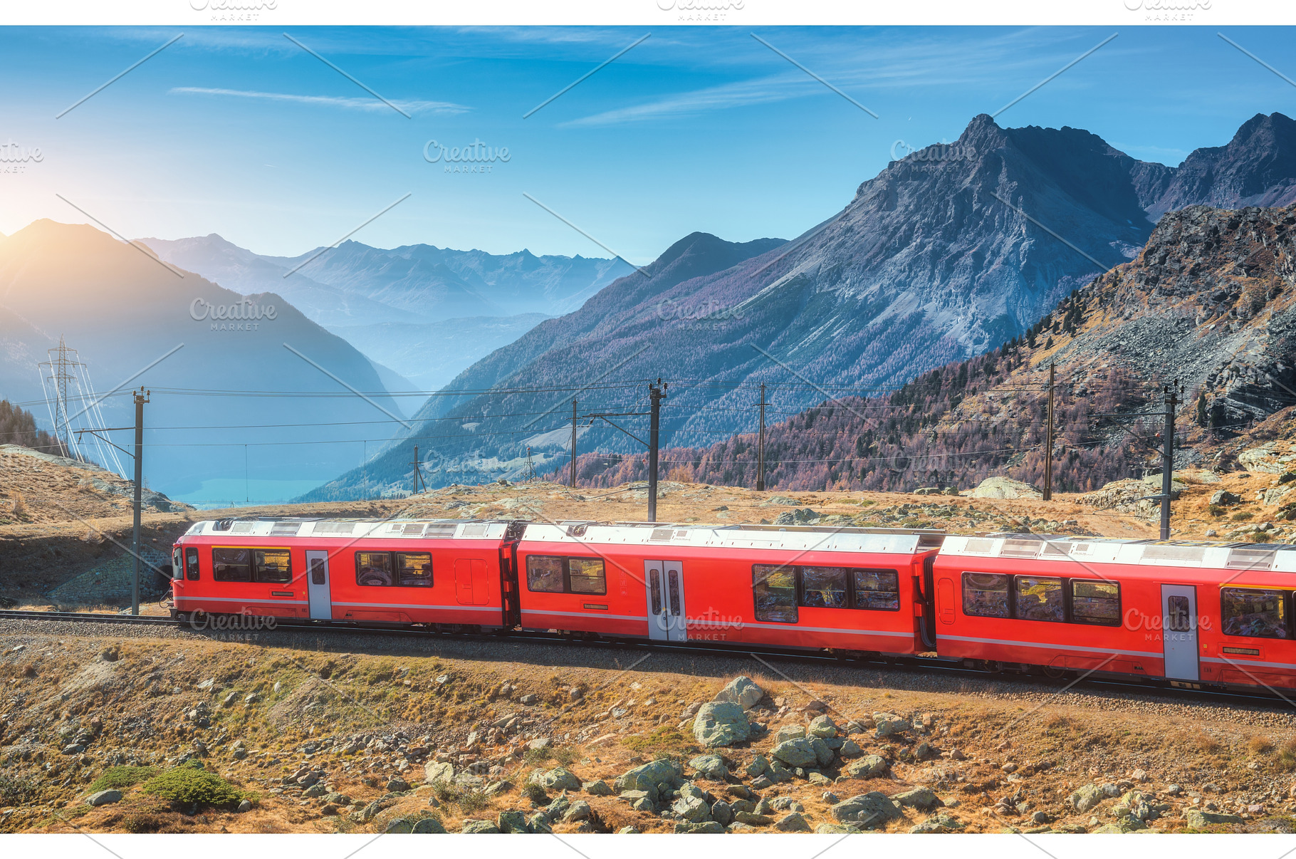 Red modern train is winding through, a Transportation Photo by den-belitsky