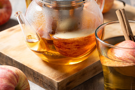 Hot apple drink with spices on wooden table, a Food & Drink Photo by etorres69
