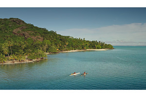 Tourists kayaking in the turquoise, a Sports & Recreation Photo by Goinyk