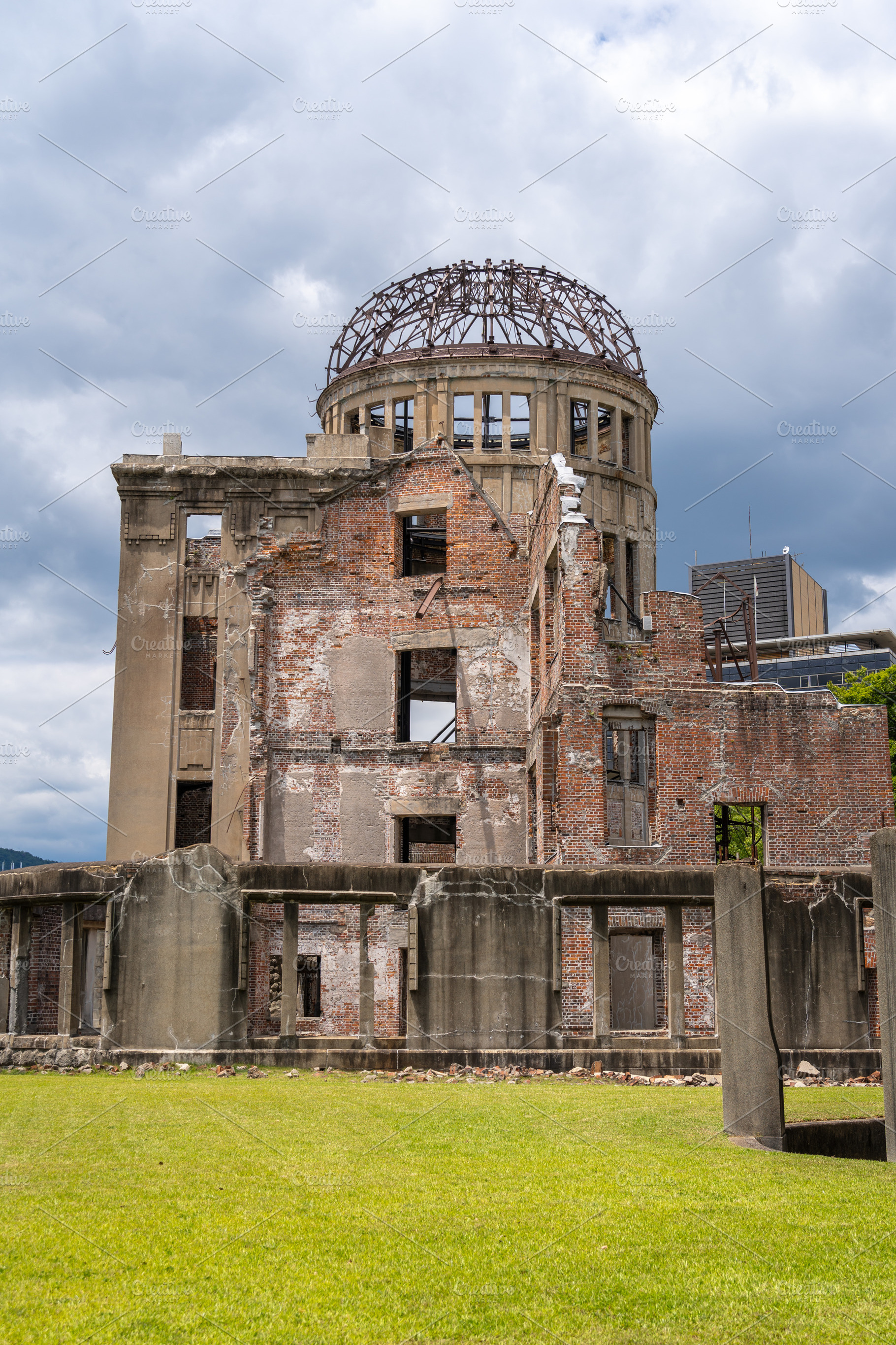 Genbaku Dome ruins at Hiroshima Peace Memorial under a cloudy sk, an Architecture Photo by GoodGoods
