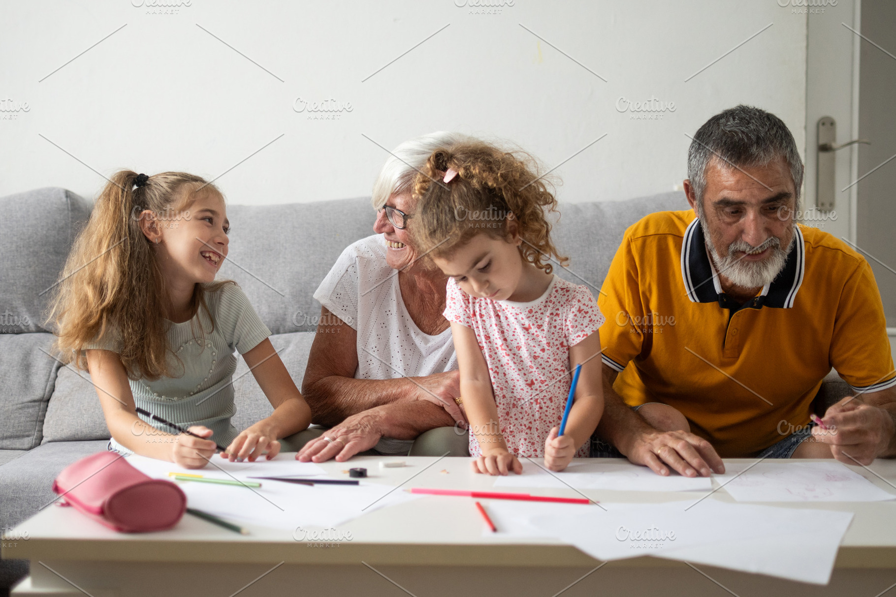 Happy Grandparents Drawing with Their Granddaughters at Home, a Person Photo by etorres69