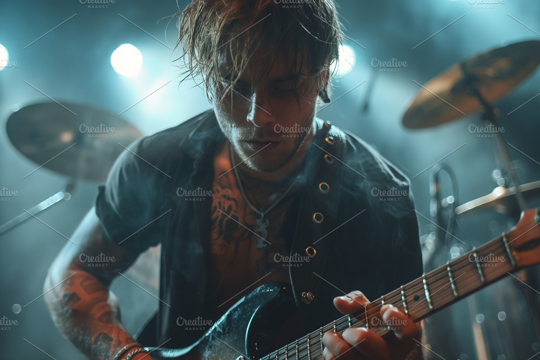 A passionate young Caucasian male guitarist performing on stage, immersed in mu, a Person Photo by ImageMir