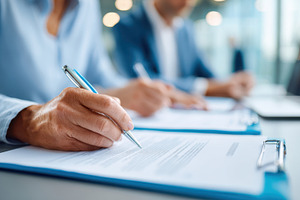 Business Professionals Signing Documents in Office, a Business Photo by AlyaAnd