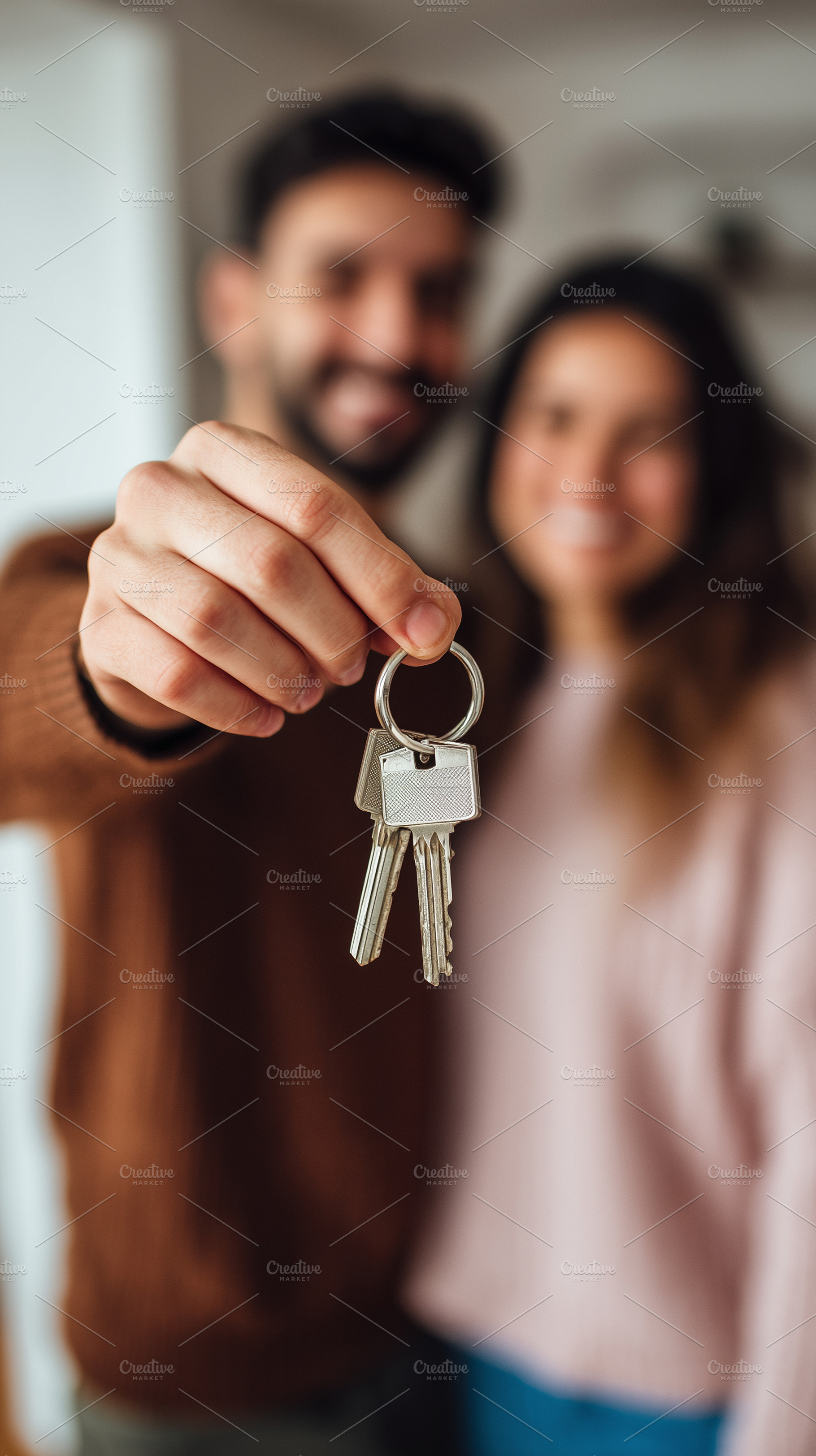 Joyful couple holds set of keys, a Business Photo by MistyDay