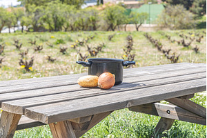 Empty black pot and vegetable on the, a Food & Drink Photo by Illustrations&photos