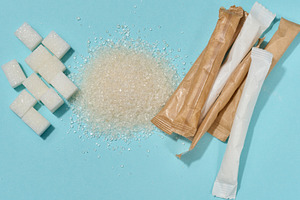 Different types of refined sugar cubes, scattered crystals and p, a Food & Drink Photo by ndanko