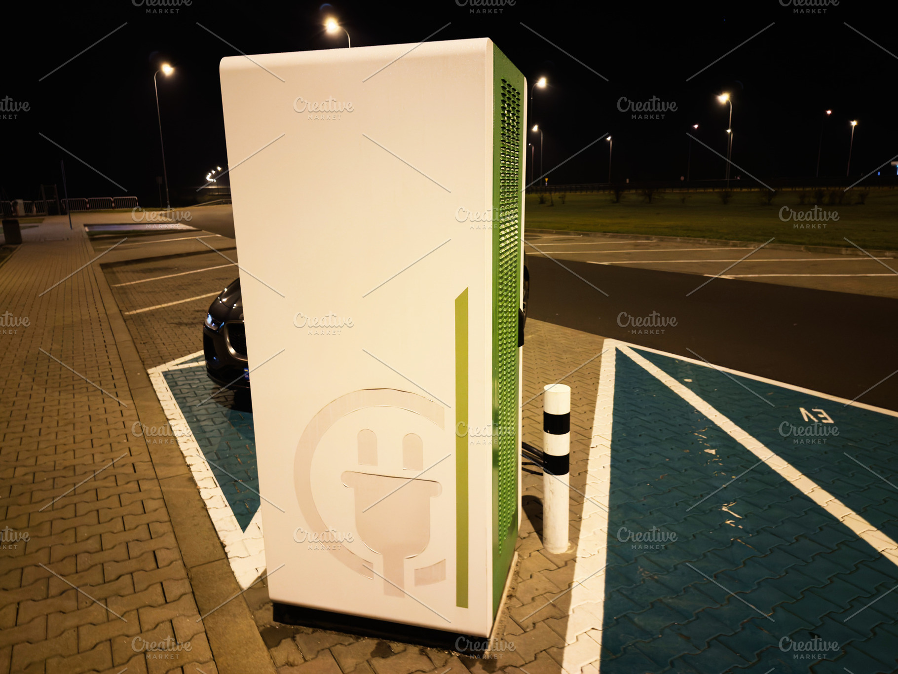 Nighttime electric car charging station in Poland parking lot with modern green, a Photo by AS photostudio