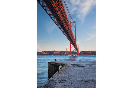 View of 25 de Abril Bridge over, an Architecture Photo by f9photos
