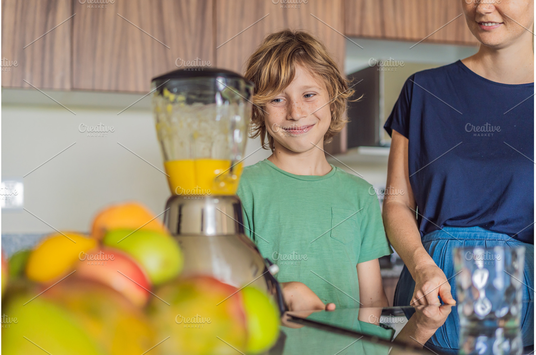 Mother and son cooking together in, a Person Photo by Elizaveta Galitskaya