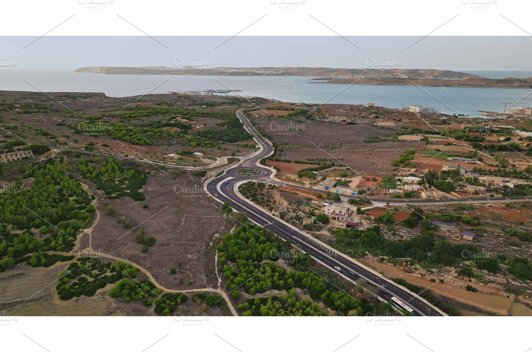 Aerial view of road crossing Malta, a Transportation Photo by Goinyk