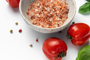 Himalayan pink salt, fresh tomatoes, and basil leaves on white b, a Food & Drink Photo by Olena Rudo