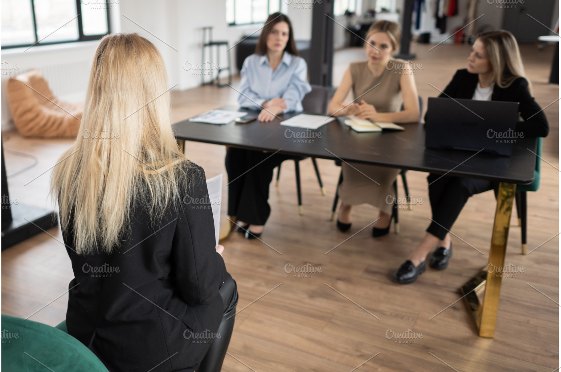 Woman applicant from behind, holding, a Business Photo by undrey