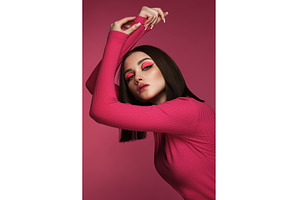 Beautiful brunette woman in pink