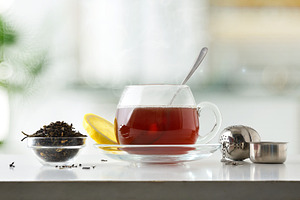 Glass teacup on a saucer on a white kitchen counter, a Food & Drink Photo by Davizro's Market