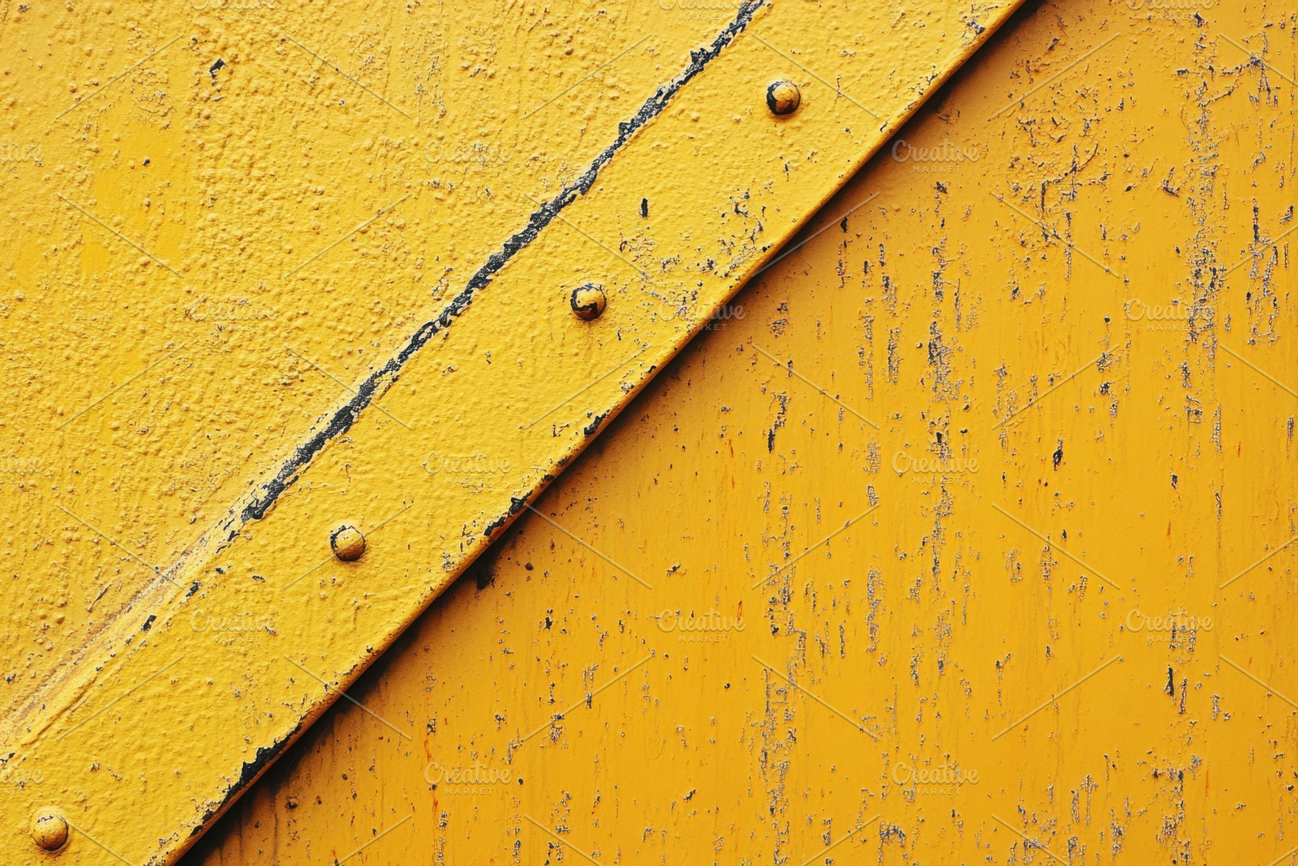 Yellow Metal Plate with Rivets and P, a Photo by Pixeness Studio
