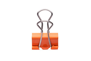 Orange binder paper clip isolated on white background. Minimalis, a Business Photo by Ales Munt