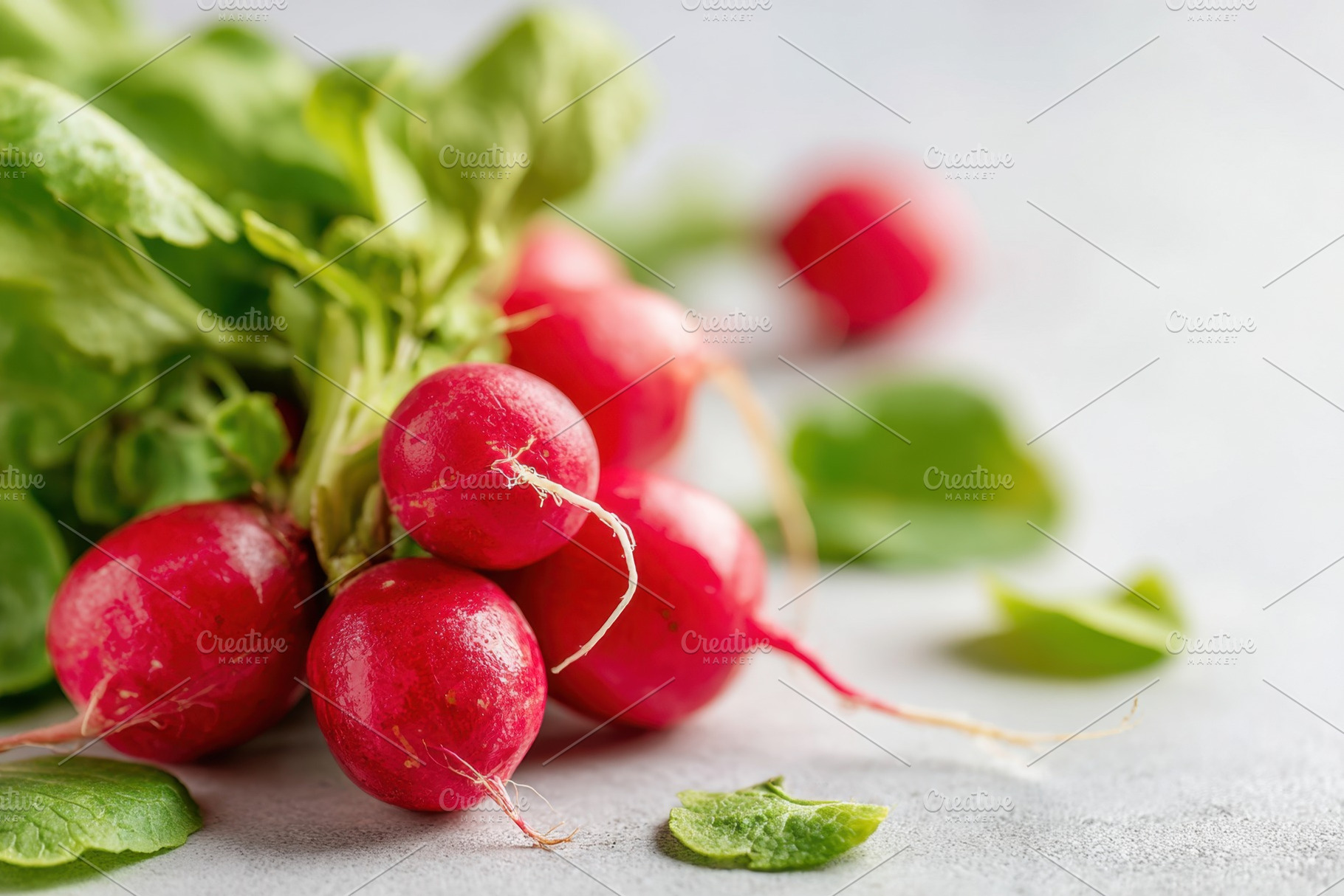 Fresh and ripe radishes with green leafs, a Food & Drink Photo by AlyaAnd