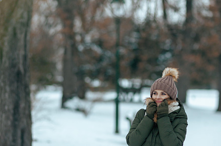 smiling modern woman outdoors in city park in winter, a Person Photo by Alliance Images