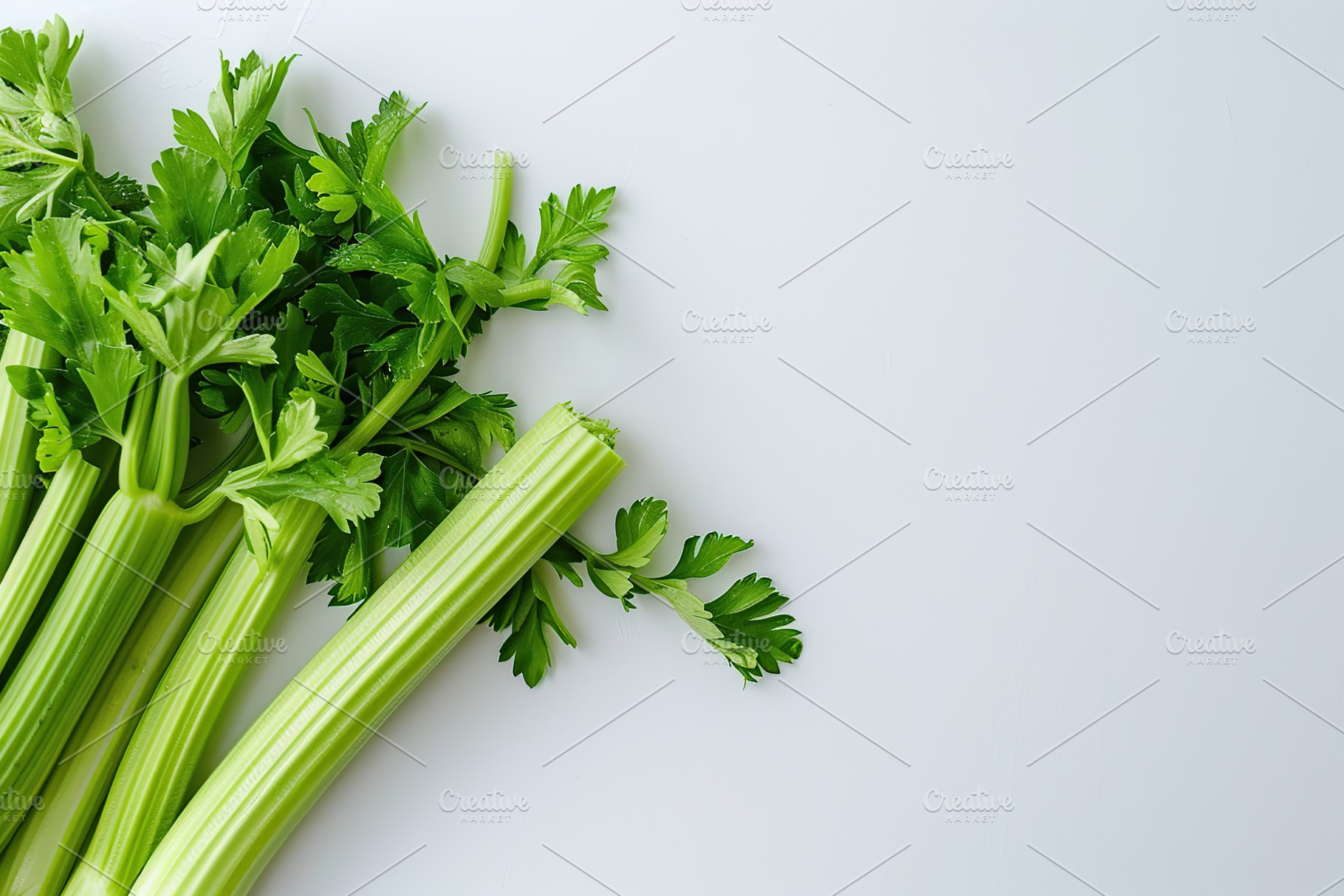 Green fresh celery sticks on white background, a Food & Drink Photo by AlyaAnd