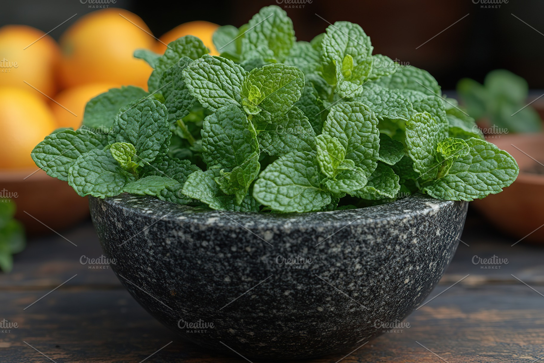 Green mint leaves in modern stone mortar on wooden table, a Food & Drink Photo by AlyaAnd
