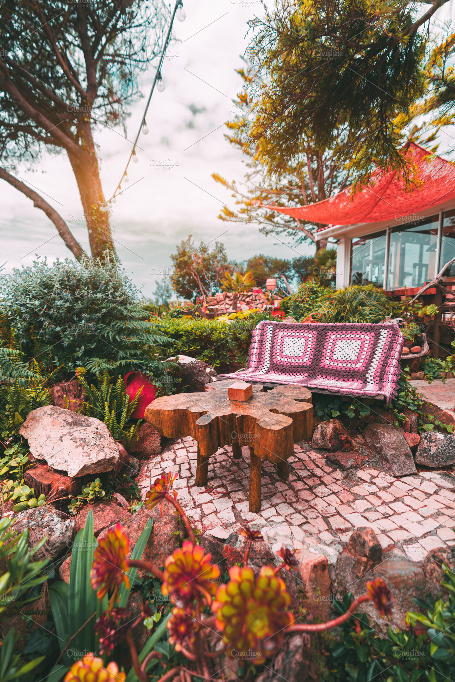 Garden bench with crochet blanket, an Architecture Photo by SkyNext