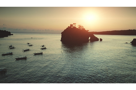 Sunset aerial view: Boats sailing in, a Nature Photo by Goinyk