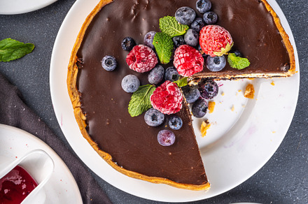 Homemade cheesecake with chocolate and berry, a Food & Drink Photo by Rimma