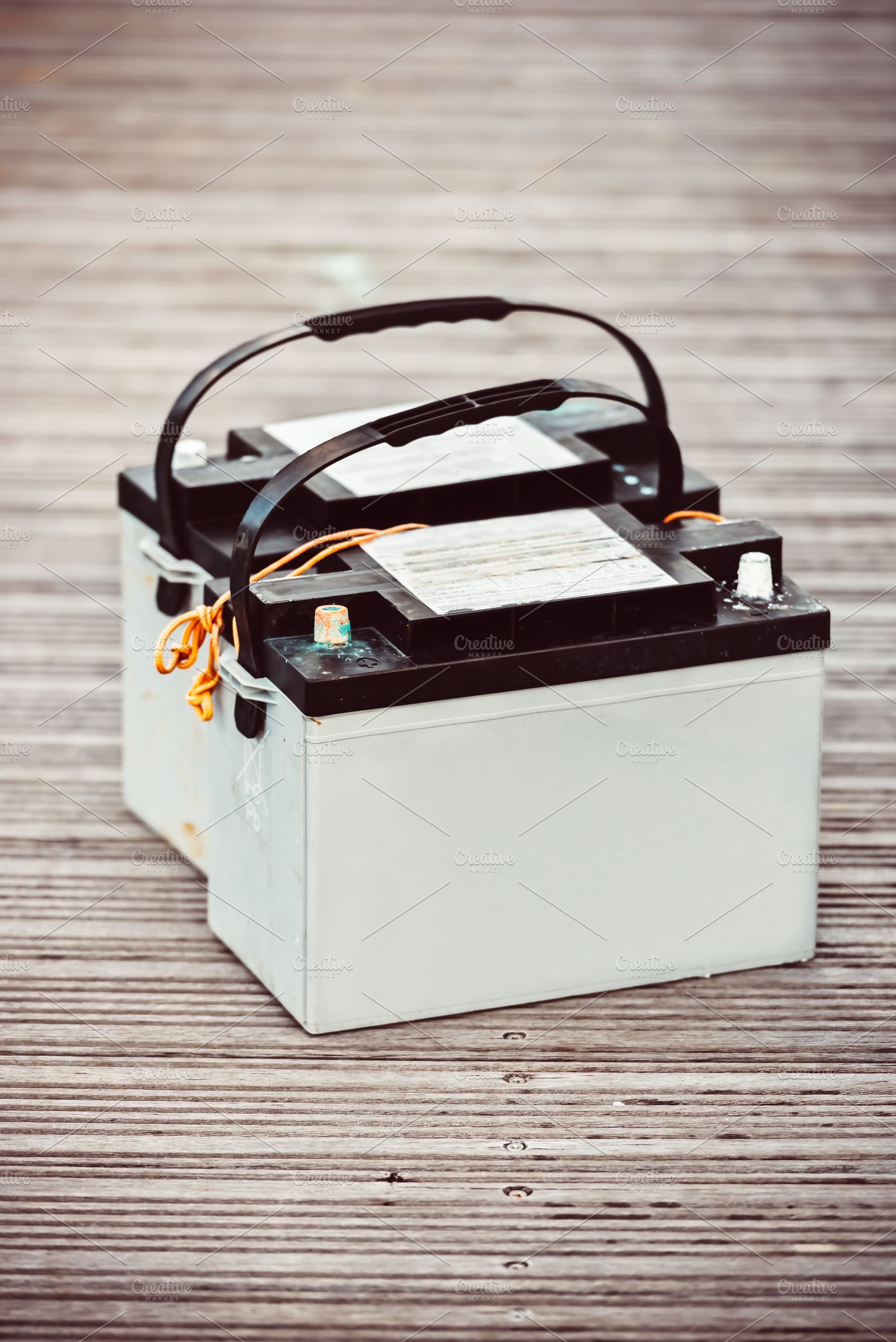 Car batteries sitting on wooden, a Photo by Dvoevnore photos