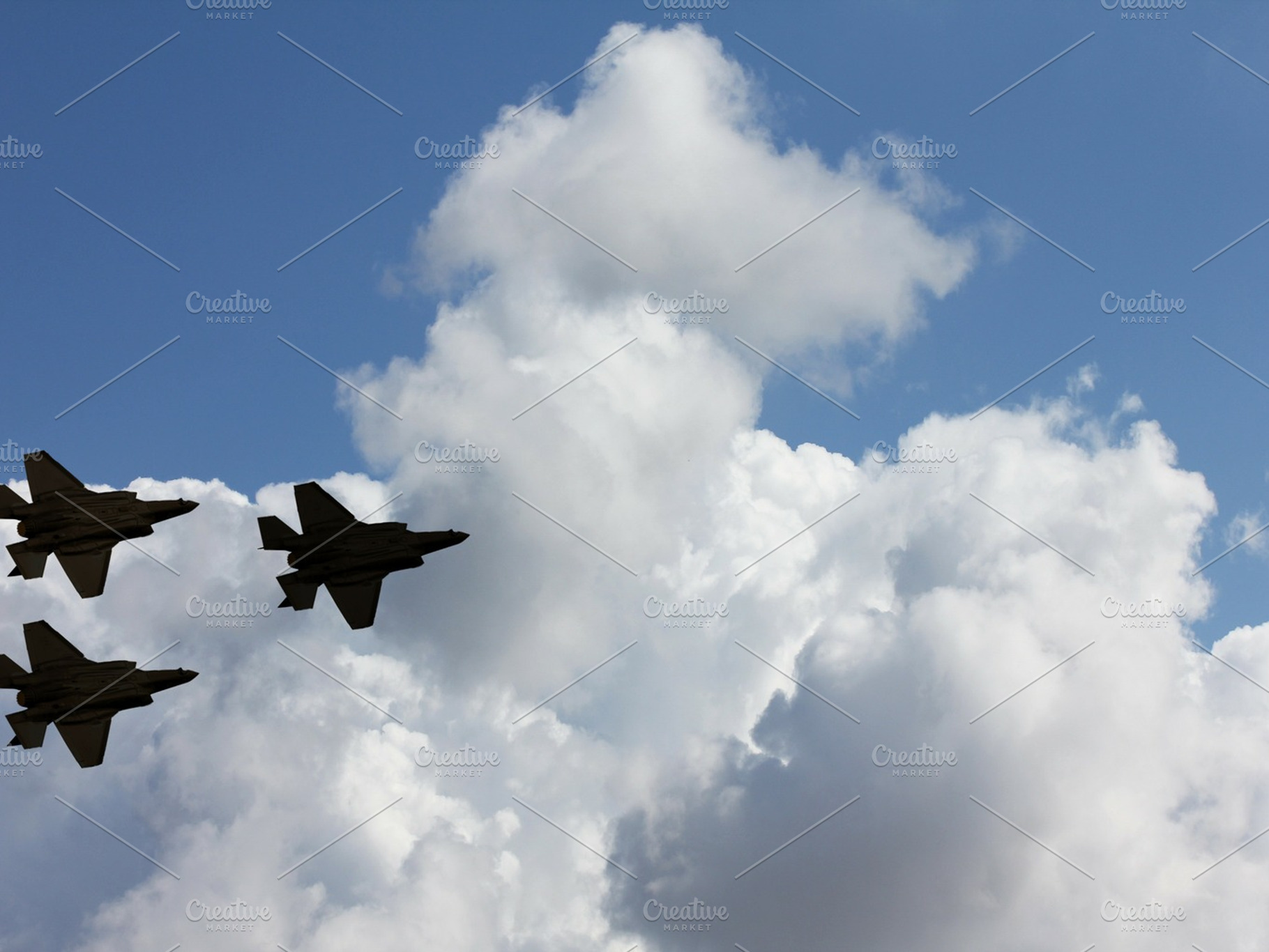 Silhouettes of three f35 aircraft against the blue sky and white clouds, a Transportation Photo by Flik47