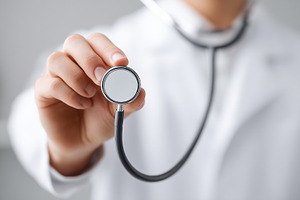 Doctor holding a stethoscope towards, a Health & Medical Photo by MistyDay