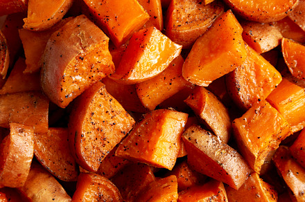 Homemade Roasted Sweet Potatoes on a Plate, top view. Overhead,, a Food & Drink Photo by LiudmylaChuhunova