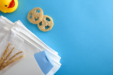 Child bath concept with gel and towel on blue table, a Health & Medical Photo by Davizro's Market